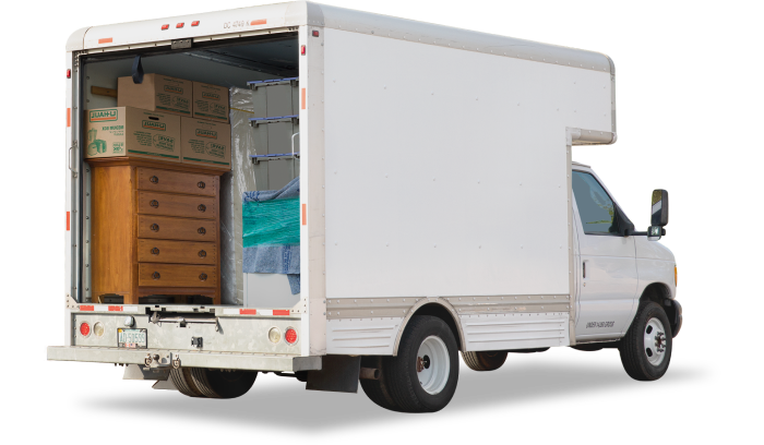 Image of a truck with the liftgate open and furniture inside of it.