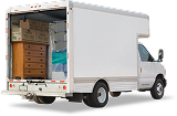 storage-lg Image of a truck with the liftgate open and furniture inside of it.